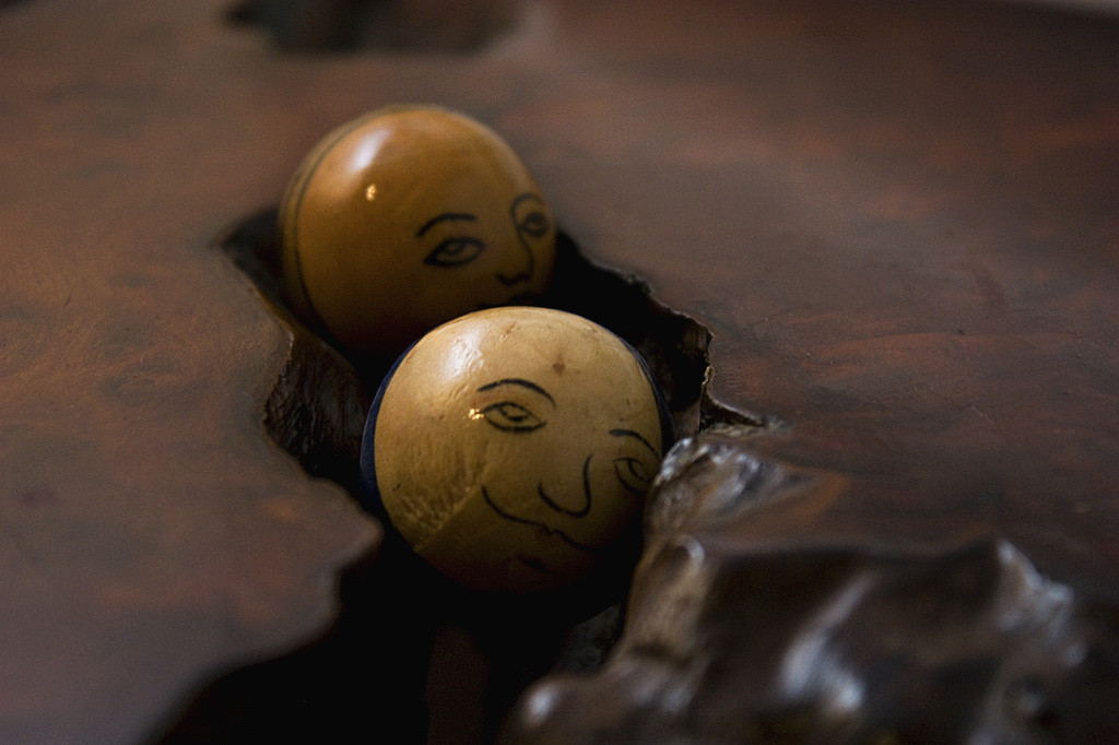Planetary spheres on the wood burl table