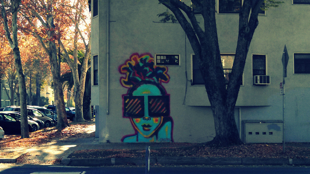 Graffiti on the side of an apartment building in Midtown Sacramento