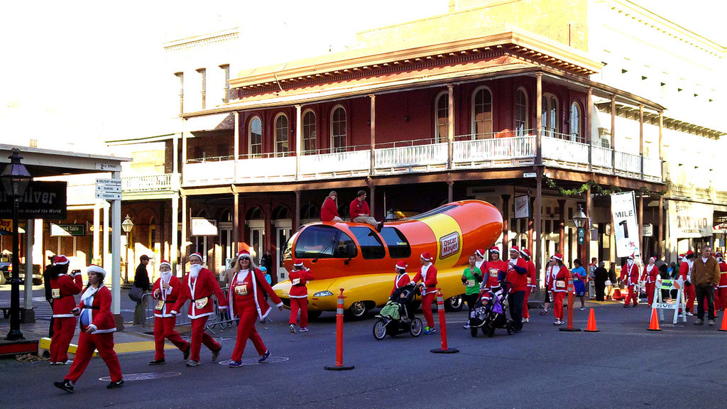 The wienermobile and Santa Run participants 