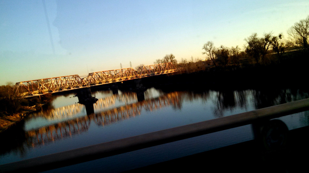 Train trestle reflections in the American River