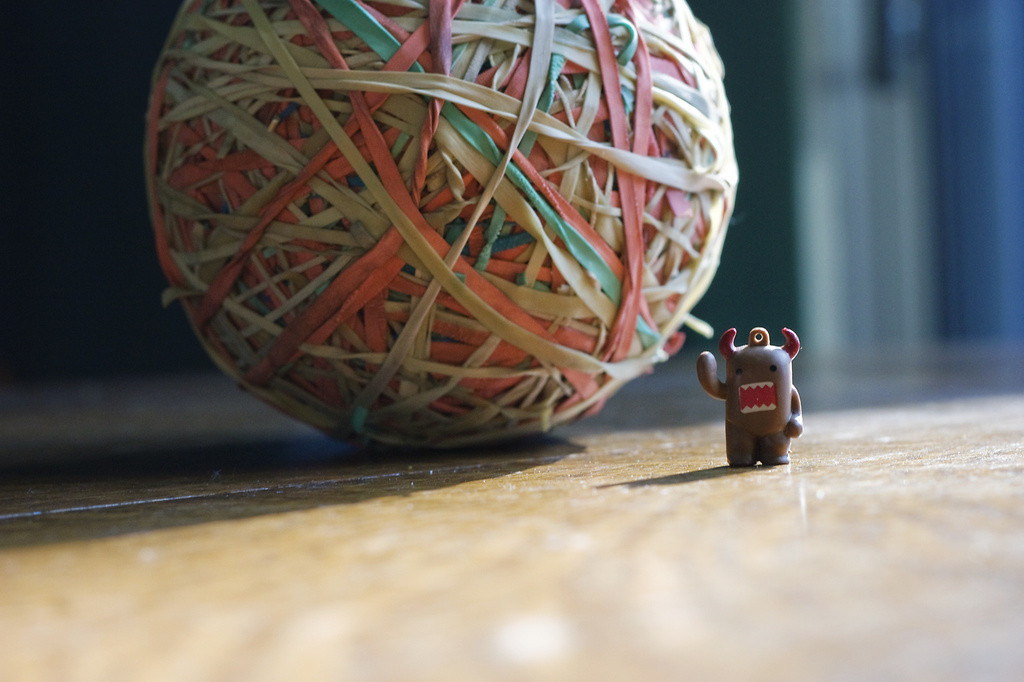 Large rubberband ball and small Domo figure