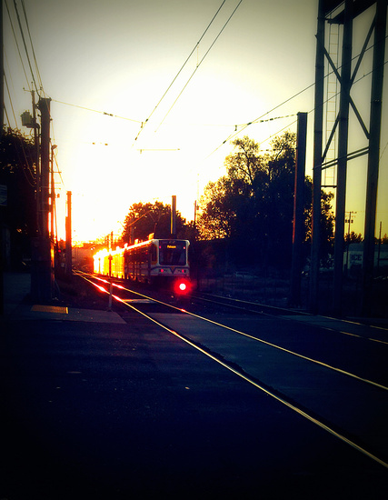 Eastbound transit train heading toward the sunrise